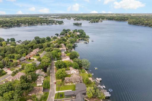 Lake and street view of 5438 Fairlawn Shores Trail SE, Prior Lake.