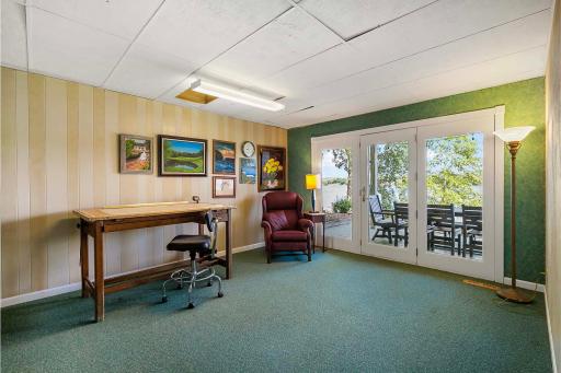 Fourth bedroom/flex room space in lower level with French doors offering fabulous views of Lower Prior Lake.