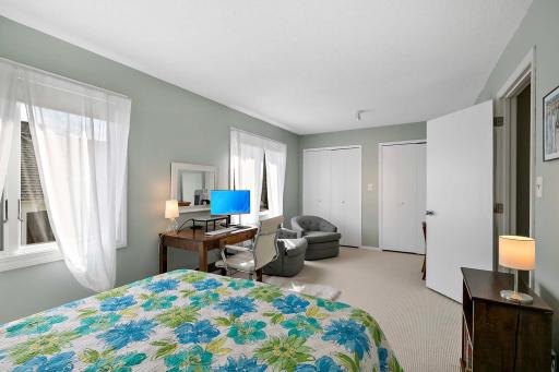 Upper level second bedroom has three closets!