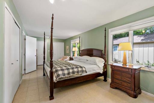 Light pours into the spacious (23' x 11') bedroom with multiple closets.