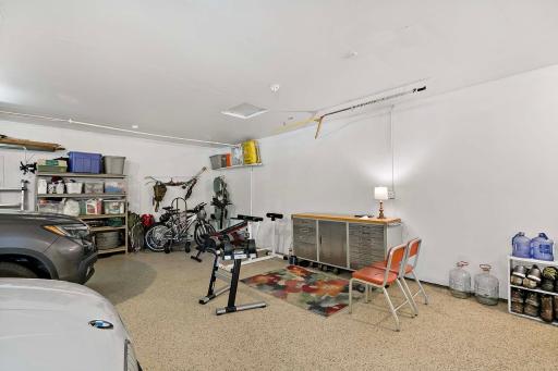 Oversized 30' x 30' finished garage with epoxy flooring.