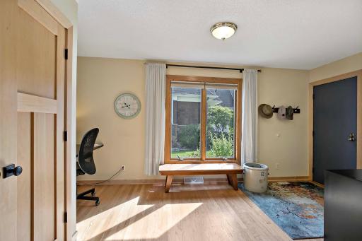 Hardwood floors and paneled doors in main level back entry and throughout home.
