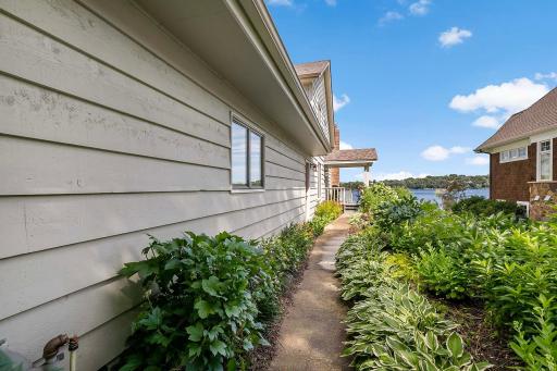 Perennial beds on either side of walkway to front entry.