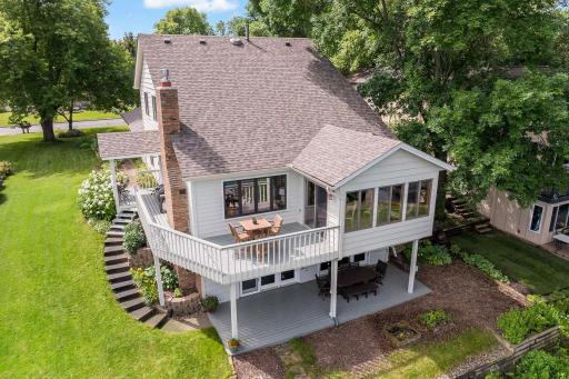 The property is on a third of an acre, this aerial view showcases the riprap shore, yard and home.