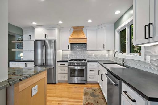 New owners will love the experience of using the Beko appliances, including stainless steel refrigerator, Pro-Style Gas Range with custom maple hardwood range hood and dishwasher.
