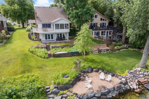 With 70-feet of lake front, this renovated two-story home has four bedrooms, three bathrooms with walkout lower level on a third of an acre.