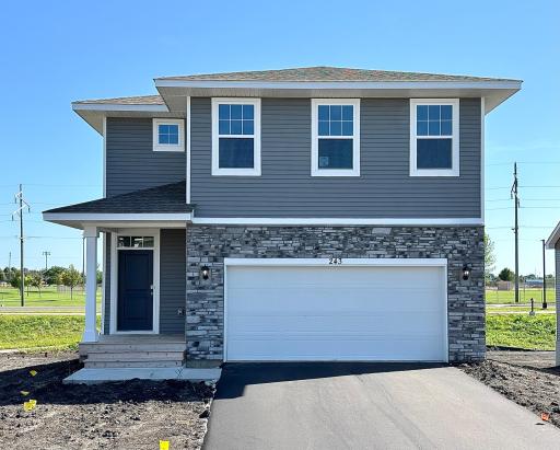 A photo of this beautiful home on a walkout lot with a completed lower level family room.