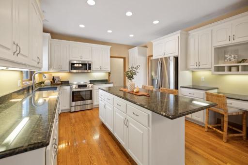 Granite countertops provide a versatile stage for everything from afternoon snacks to multi-course meals.