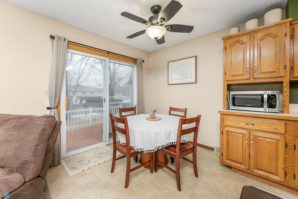 Dining area & patio door to maintenance-free deck & fenced backyard