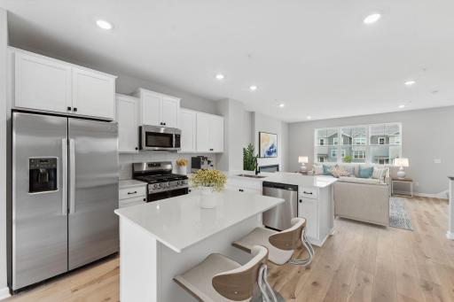 Kitchen looking to family room. Photo of actual home virtually staged.