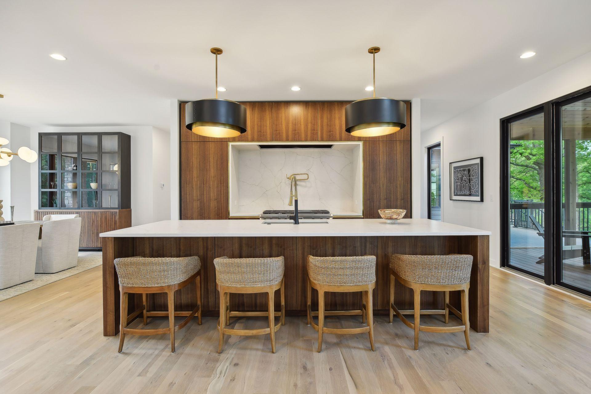 A Custom Designed Gourmet kitchen features sleek cabinetry, Chef quality appliances, and epansive entertainment space.