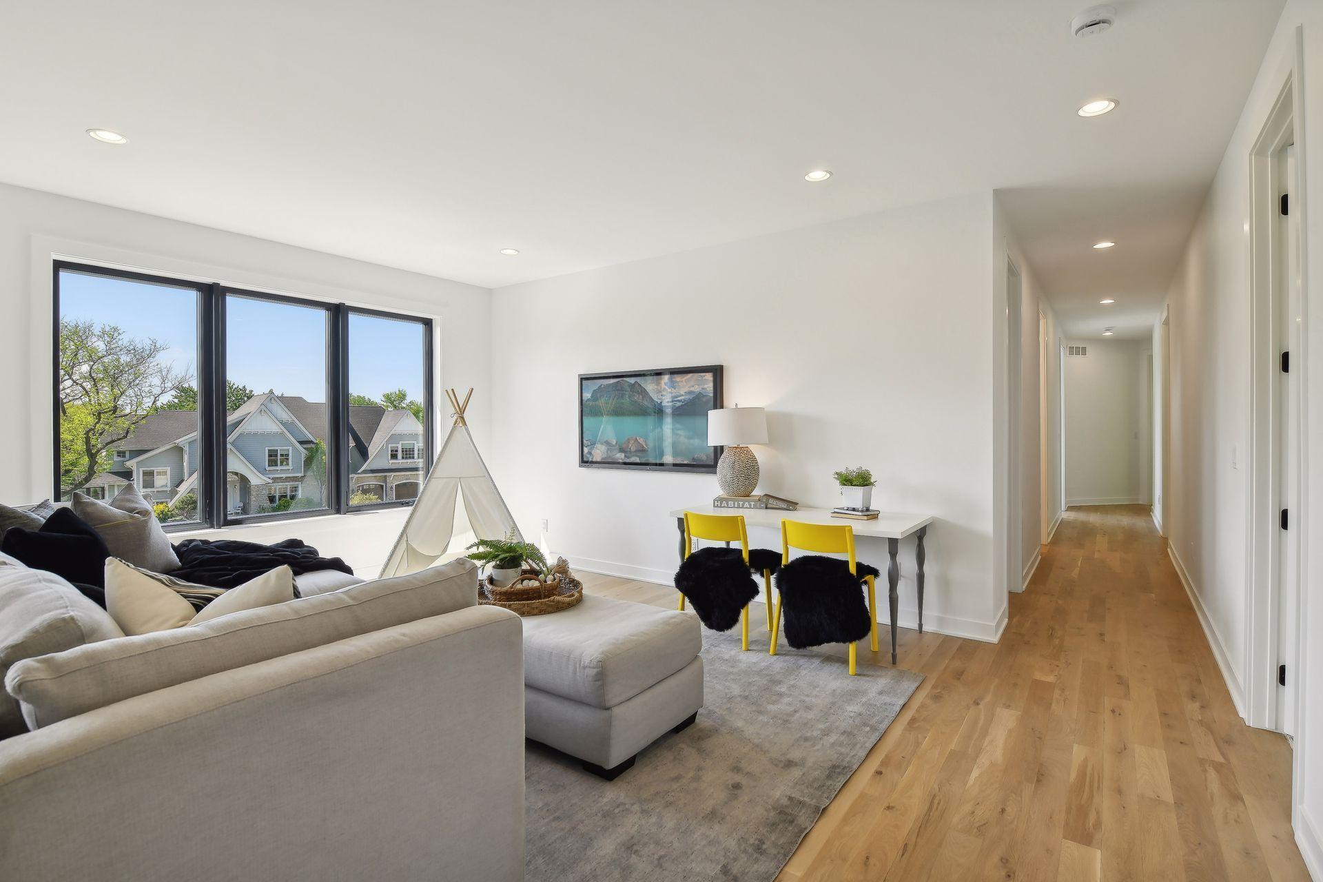 An upper family room space is perfect for gathering, studying or creating another entertainment space