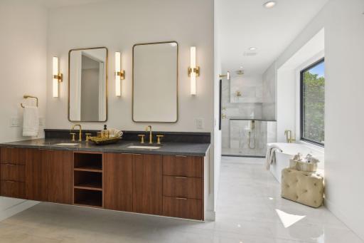 Luxurious bathroom retreat with dual vanities, soaking tub, and elegance.