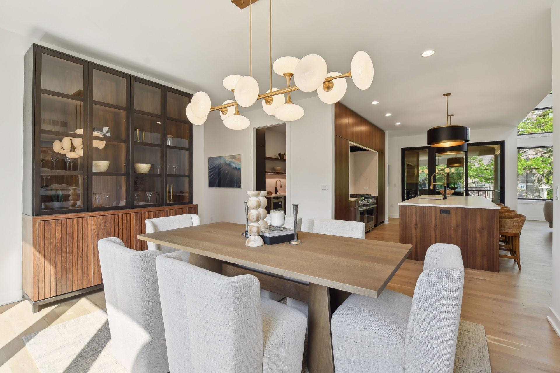 Bright and inviting dining room with modern lighting.