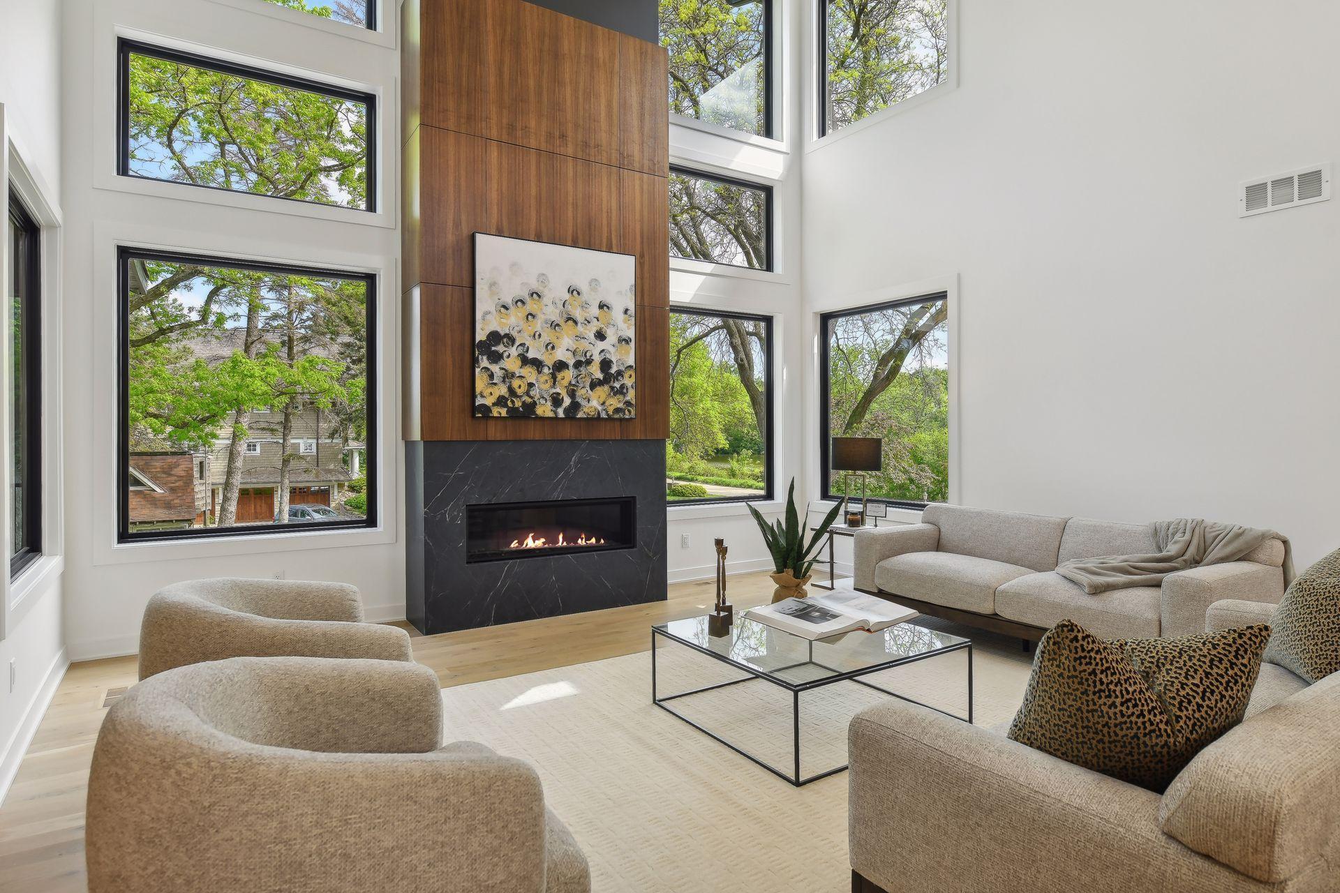 Floor-to-ceiling windows frame two stunning ponds and lush greenery.