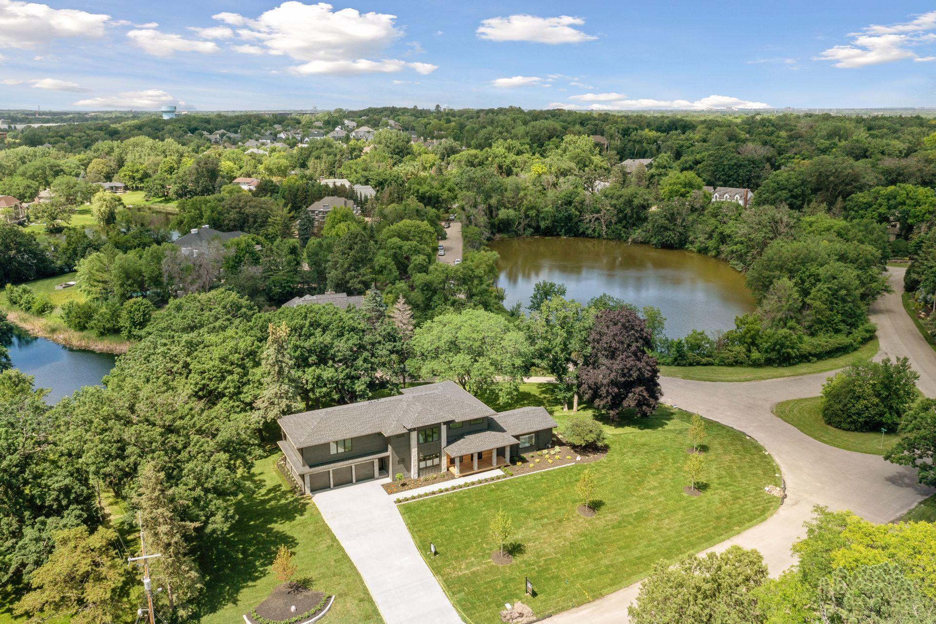 Sunset views cast golden hues over tranquil backyard pond settings.