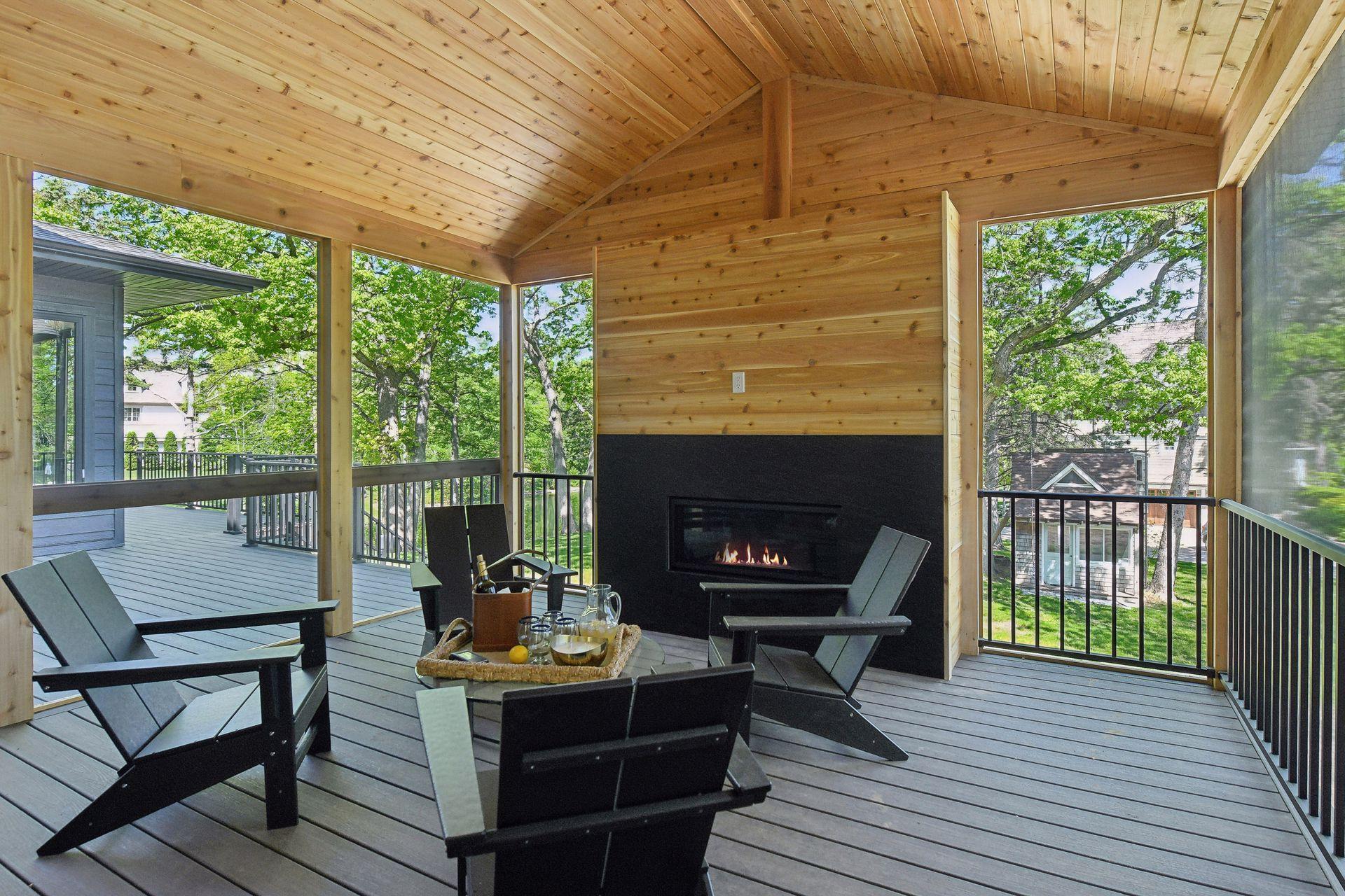 Porch fireplace offers cozy gatherings no matter the season outside.