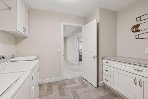 The laundry room is conveniently located on the upper level.