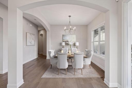 Property has been virtually staged as a formal dining room.