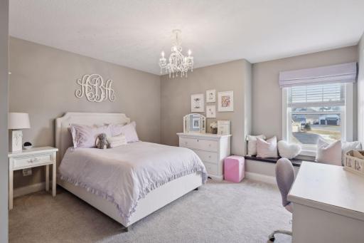 Three additional bedrooms, loft, and laundry complete the upper level.