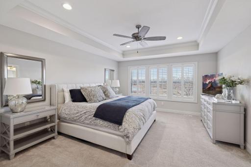 Retreat to the upper level primary bedroom with luxurious bathroom.