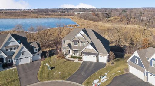 Introducing 9170 Eagle Court in the beautiful Foxwood neighborhood of Chanhassen, Minnesota. Nestled on a private 0.4-acre lot, this 2017-built Gonyea home boasts five bedrooms, five bathrooms, and a sport court across 5,411 finished square feet.
