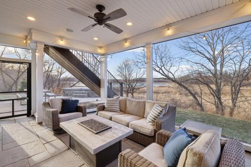 Outdoor amenities include a screened porch, swim spa, deck, professional landscaping, sweeping pond views, and spectacular sunsets.