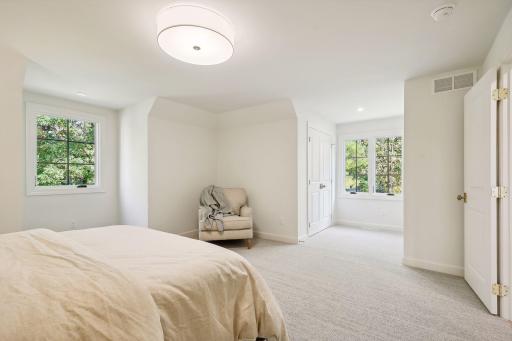 This stunning bedroom showcases unique architectural features that add character and charm