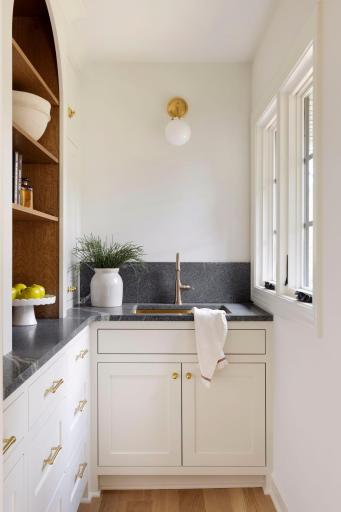 A sunny butler's pantry with open cross sawn oak and soap stone overlooking the backyard will be a favorite spot to make your coffee in the morning