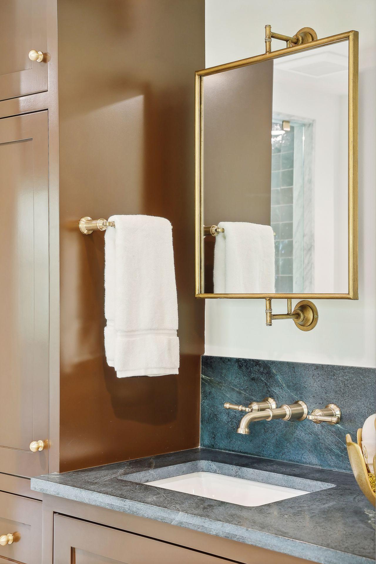 Primary bath features stylish modern fixtures that elevate the space with their sleek design.