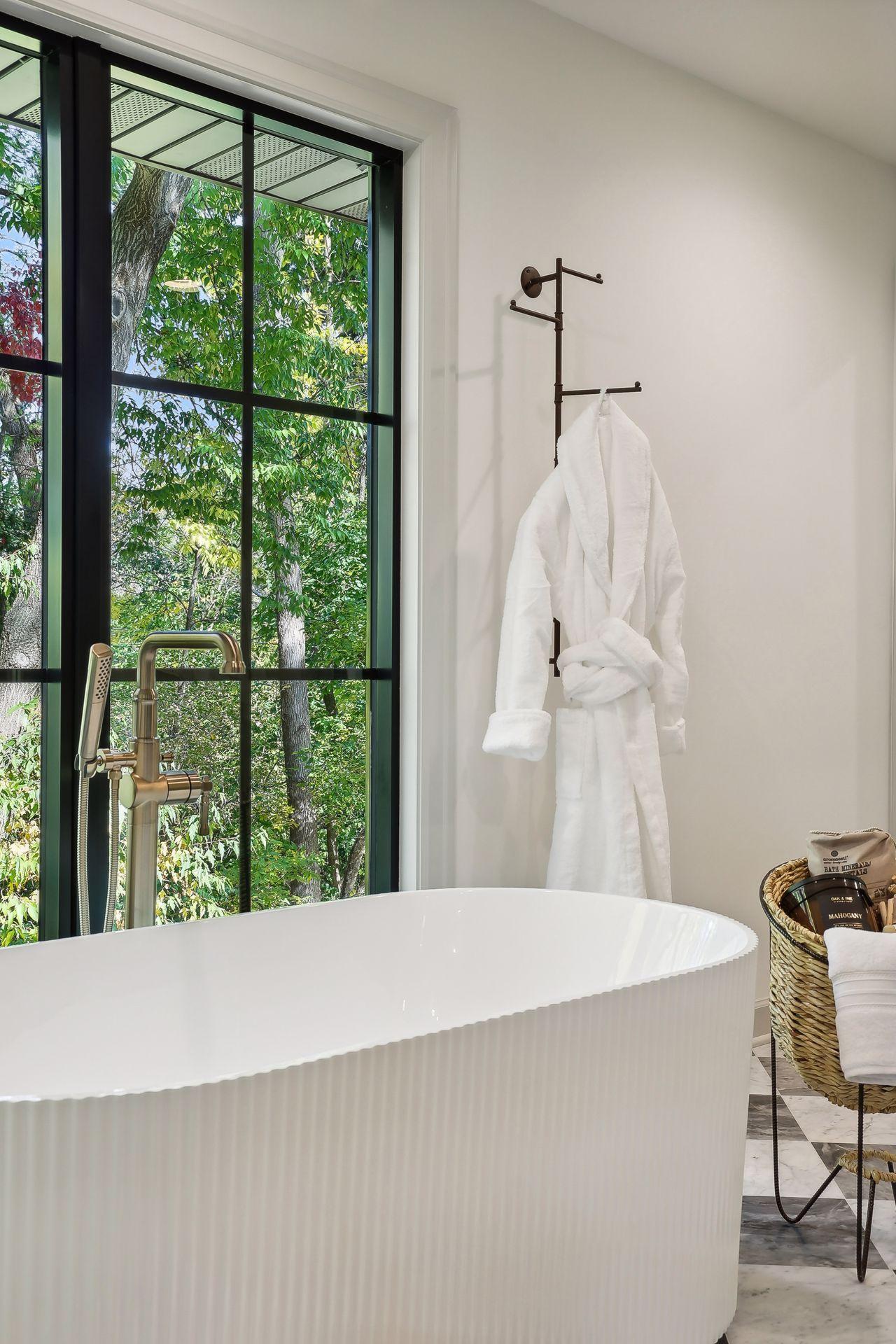 Unwind in this exquisite soaking tub, nestled in the luxurious primary bath. Designed for relaxation, it offers the perfect escape to indulge in self-care and tranquility, making every bath a rejuvenating experience.