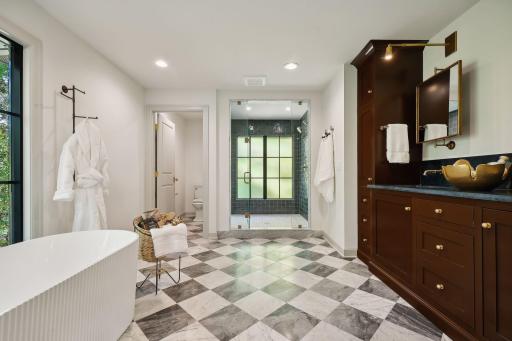 Indulge in this spa-like primary bath, featuring an amazing soaking tub and a spacious walk-in tiled shower. Designed for relaxation and rejuvenation, this serene retreat offers the perfect escape from the everyday hustle and bustle.