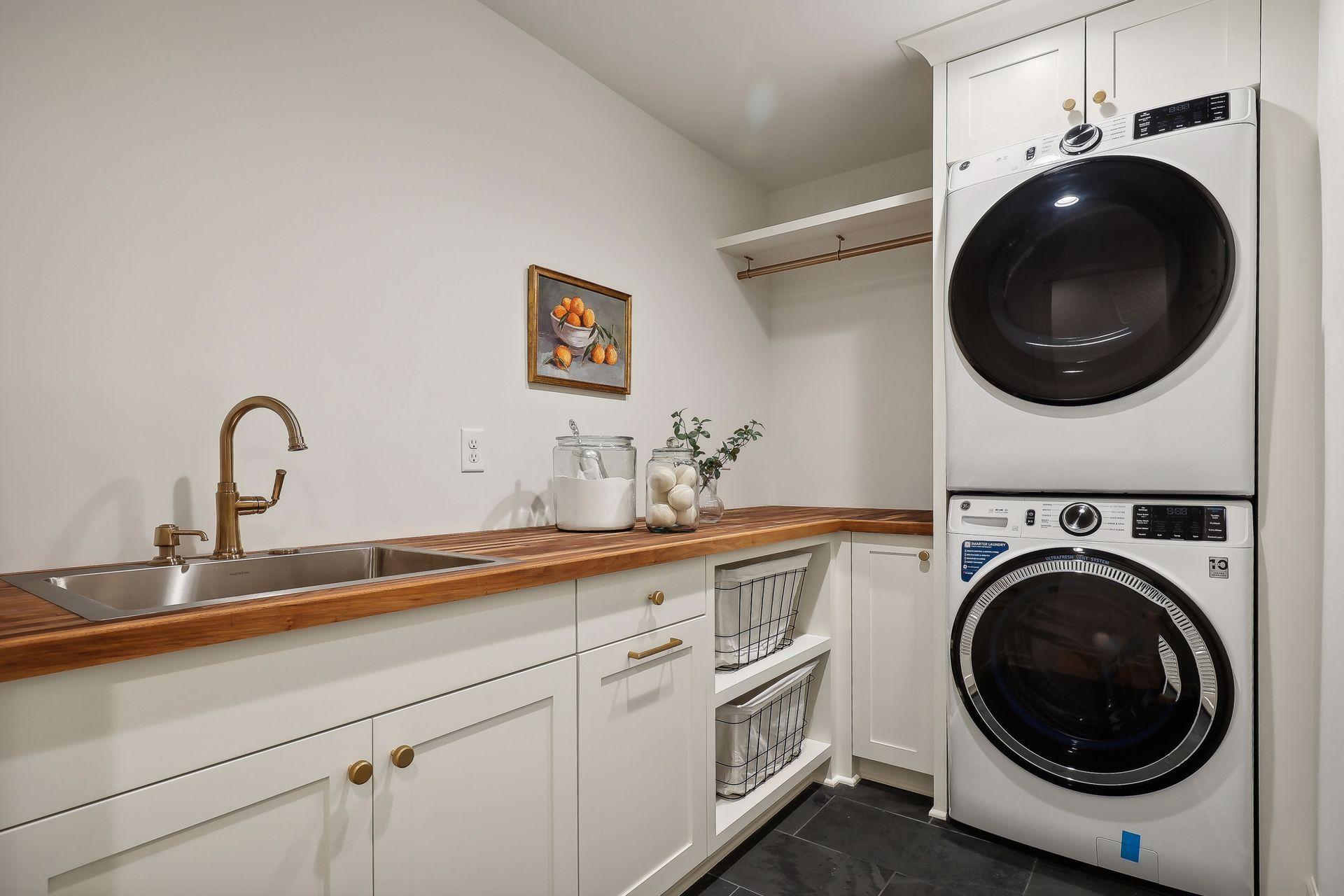 This thoughtfully designed main floor laundry is conveniently located just off the primary suite, adding ease and functionality to your daily routine.