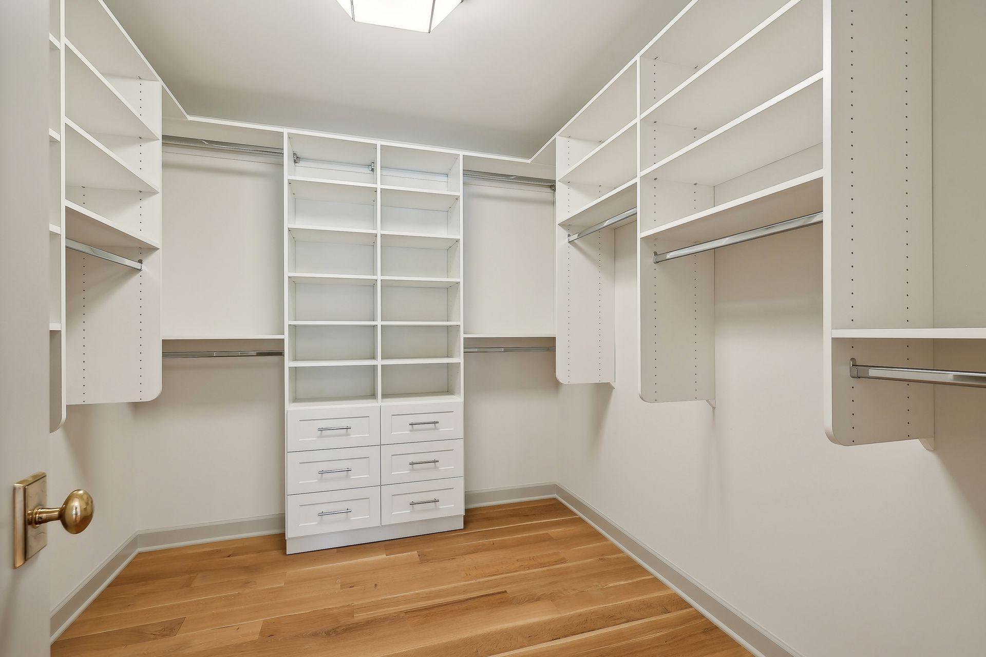 This massive walk-in closet offers ample storage and organization, making it a dream for fashion lovers.