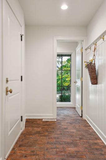 Step into this inviting entrance featuring elegant tile floors and a spacious double closet for ample storage.