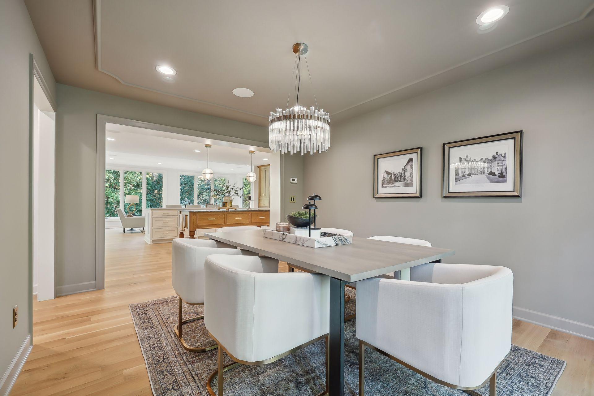 Experience refined living in this elegant dining room that flows effortlessly into a stunning kitchen.