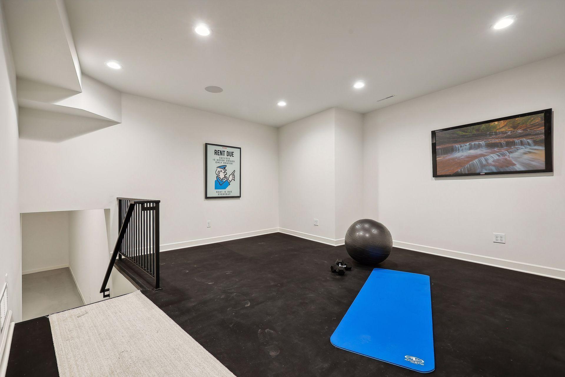 This well-appointed home gym offers a private space to pursue your fitness goals. Featuring modern equipment and ample room for workouts, it’s the perfect environment to stay active and energized without leaving home.