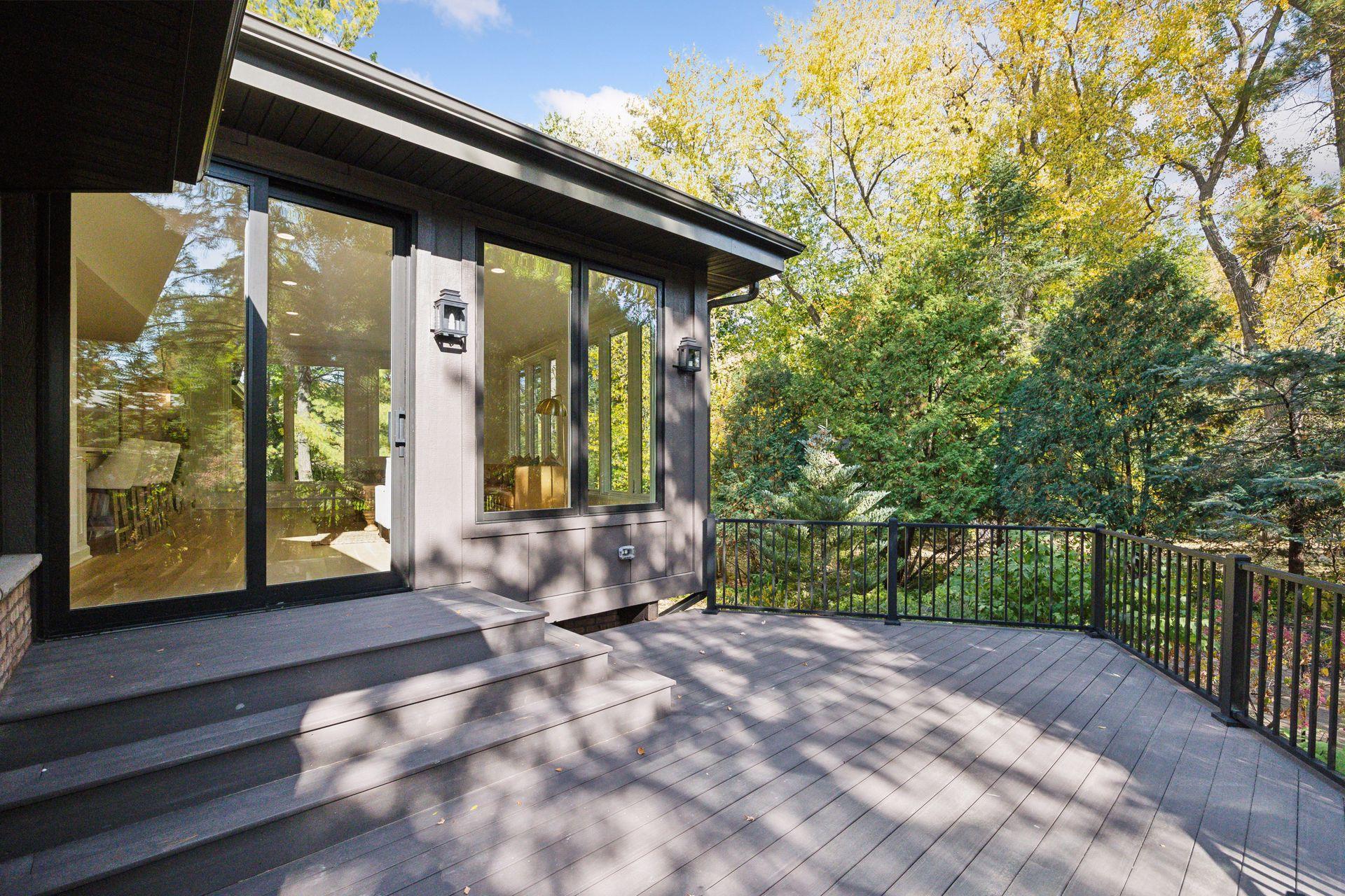 The deck is perfect for entertaining or quiet moments with nature, this outdoor space offers a seamless blend of tranquility and privacy.