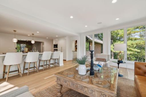 This luxury kitchen flows effortlessly into the family room, offering stunning views and a seamless connection to the adjoining pantry.