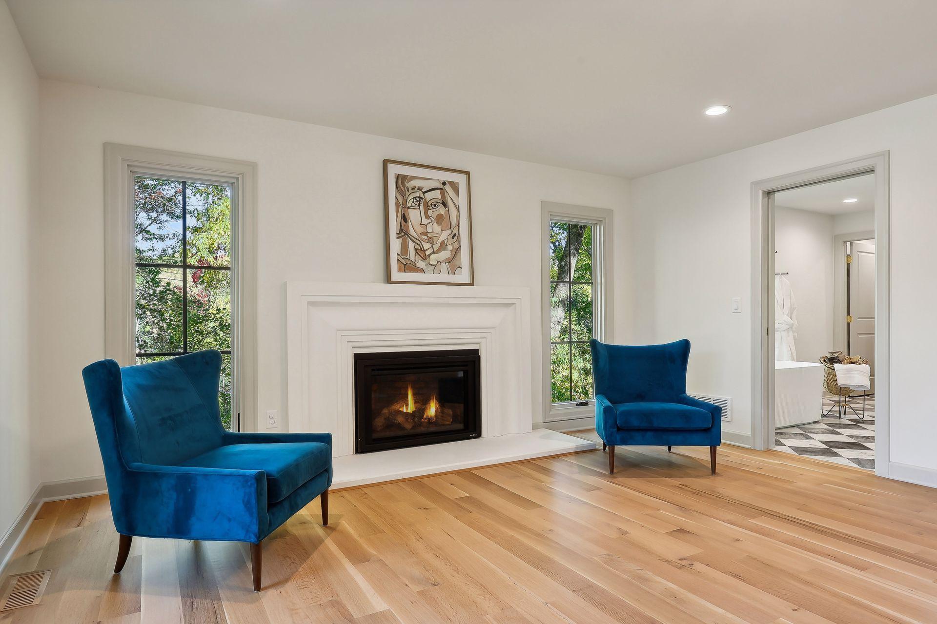 This inviting primary suite features a charming fireplace, adding warmth and ambiance to your personal retreat.