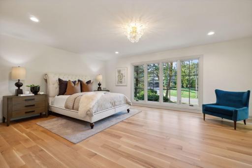 This stunning primary bedroom is filled with beaming natural light, creating a warm and inviting atmosphere. The spa-like bath adds a touch of luxury, offering a perfect retreat for relaxation and rejuvenation. Experience ultimate comfort!