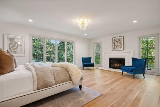 Luxurious primary suite on the main level, designed for ultimate comfort and relaxation. Featuring elegant finishes, ample space, and a serene ambiance, it's the perfect retreat to unwind after a long day. Experience the epitome of luxury living!