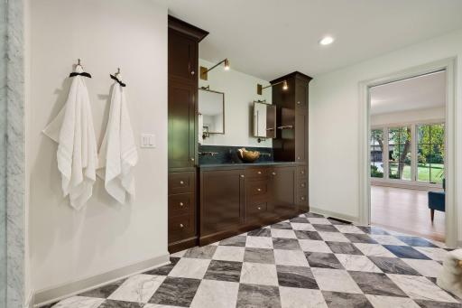 This stylish bathroom vanity showcases warm wood tones paired with modern fixtures, creating a perfect blend of sophistication and functionality. A welcoming focal point, it enhances the overall design of the space while providing ample storage.