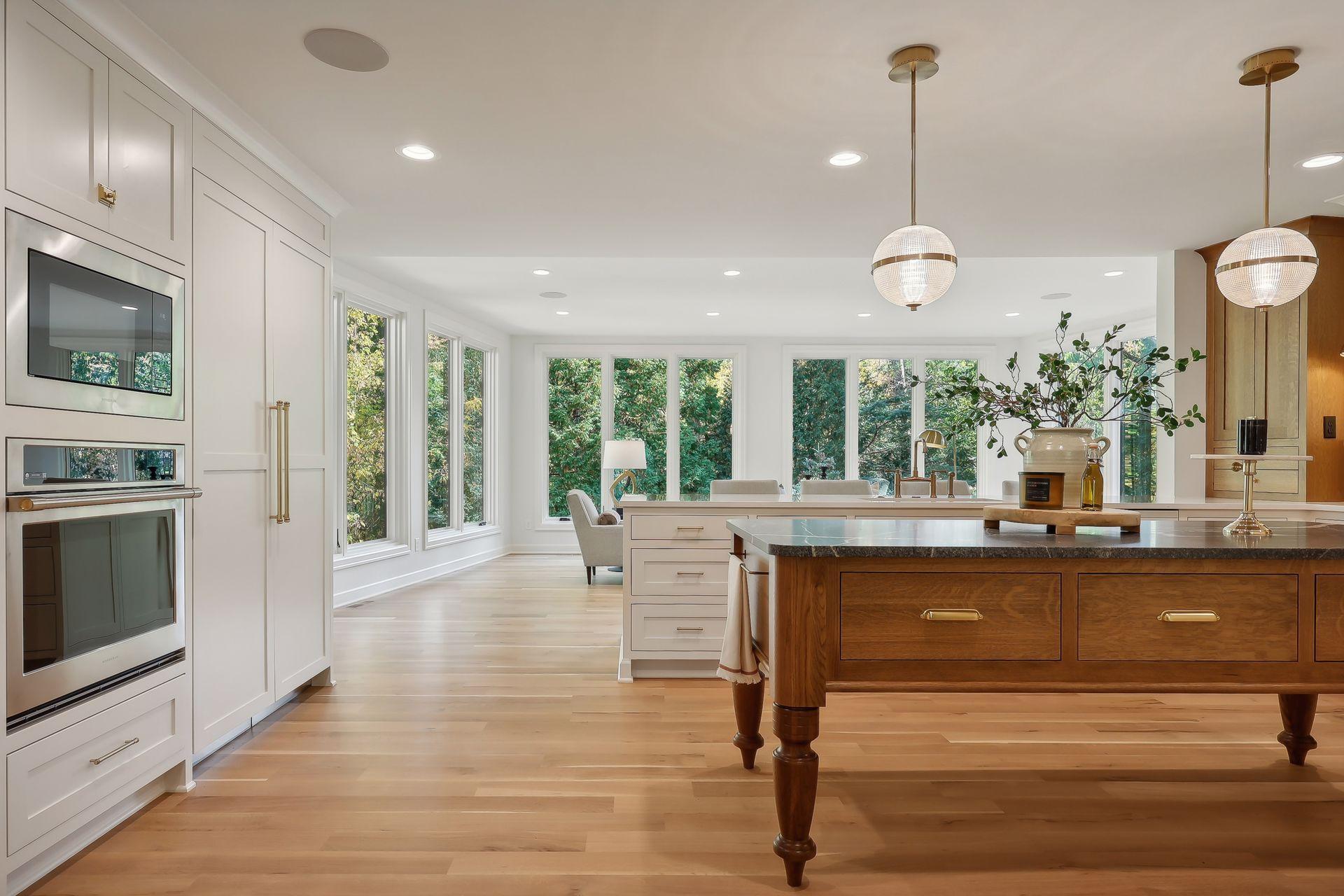 This exquisite kitchen features top-of-the-line appliances, a stunning wood island, and a convenient double oven, perfect for culinary enthusiasts.