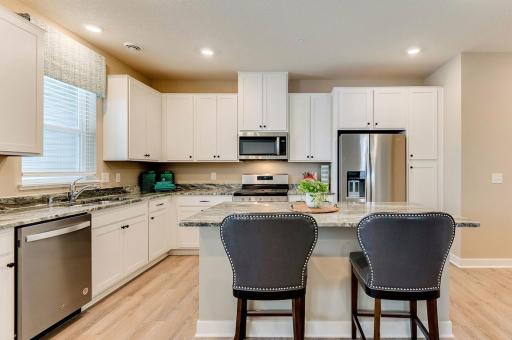 Granite countertops, stainless steel appliances and the microwave is vented to the outside! *Photos of model home, finishes and options will vary.