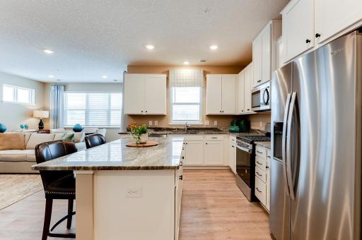 Open floorplan throughout the main floor. *Photos of model home, finishes and options will vary.
