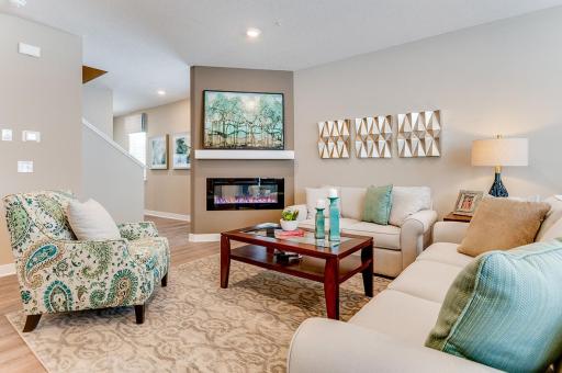This end unit includes a chic electric fireplace. Heat or no heat, your choice - and gives you some ambiance all year round! *Photos of model home, finishes and options will vary.