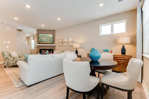 Dining room is open to the back of the home and is exposed to the large windows letting in the natural light. Photos from previous model home, finishes and options to vary.