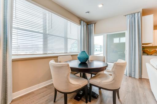 Dining room and a peek at the covered patio off the back. *Photos of model home, finishes and options will vary.