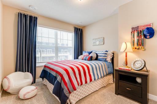 On the opposite side of upstairs from the primary are 2 more generous bedrooms. *Photos of model home, finishes and options will vary.